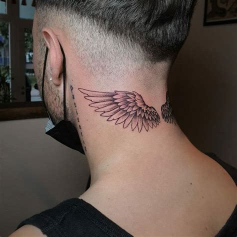 angel wings on neck tattoo|angel wings back tattoo male.